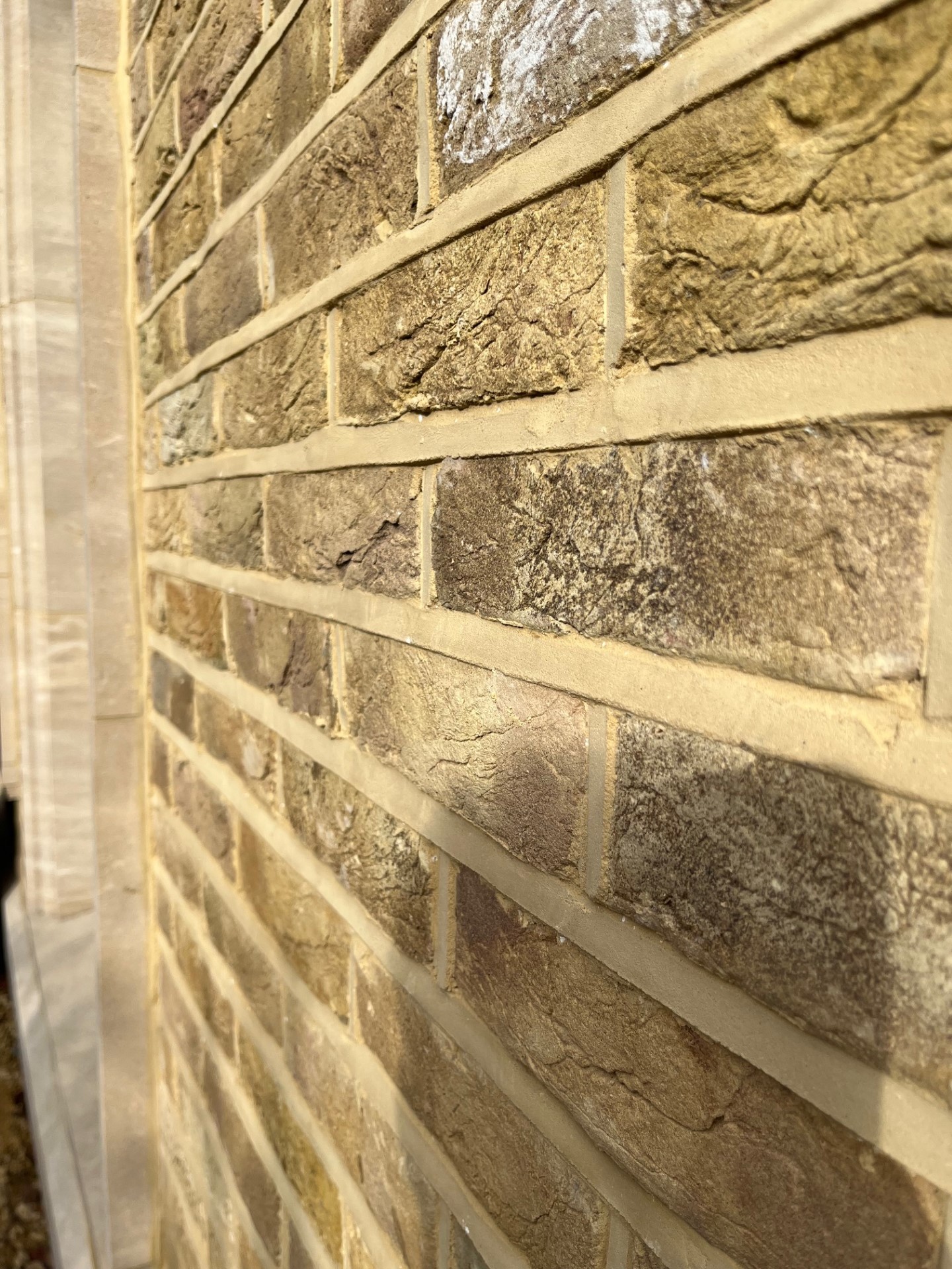 Close-up of lime mortar weather-struck pointing finish showing joint detail, Wimbledon