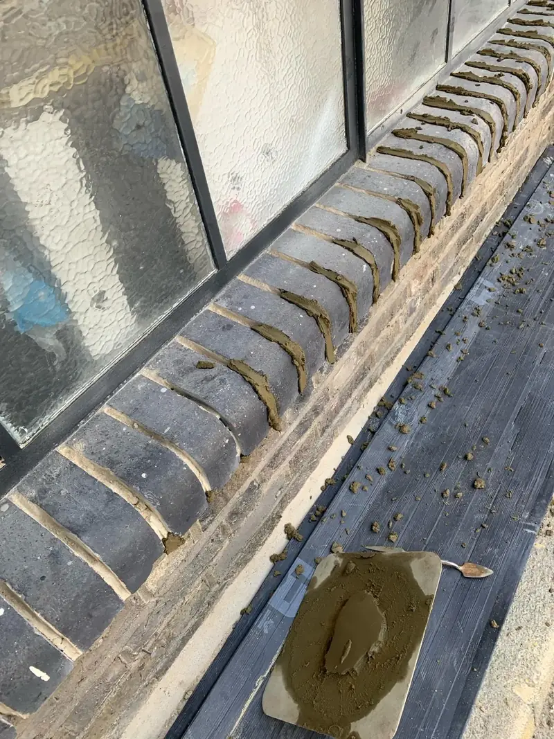 Before — deteriorated cement mortar joints, Tottenham